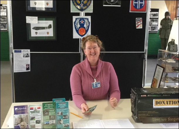 Volunteer welcoming visitors to the Upottery Nissen Hut Heritage Centre